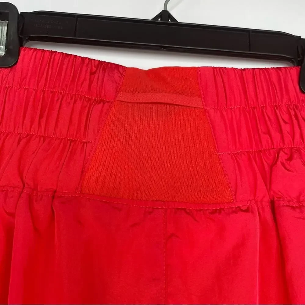FP Movement Free People neon orange high waisted shorts size Medium